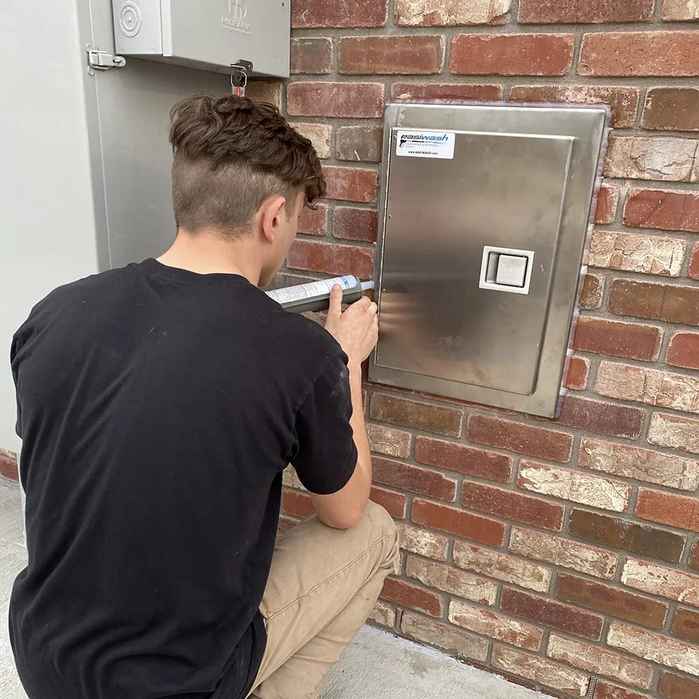 Easiwash technician performing a professional system installation